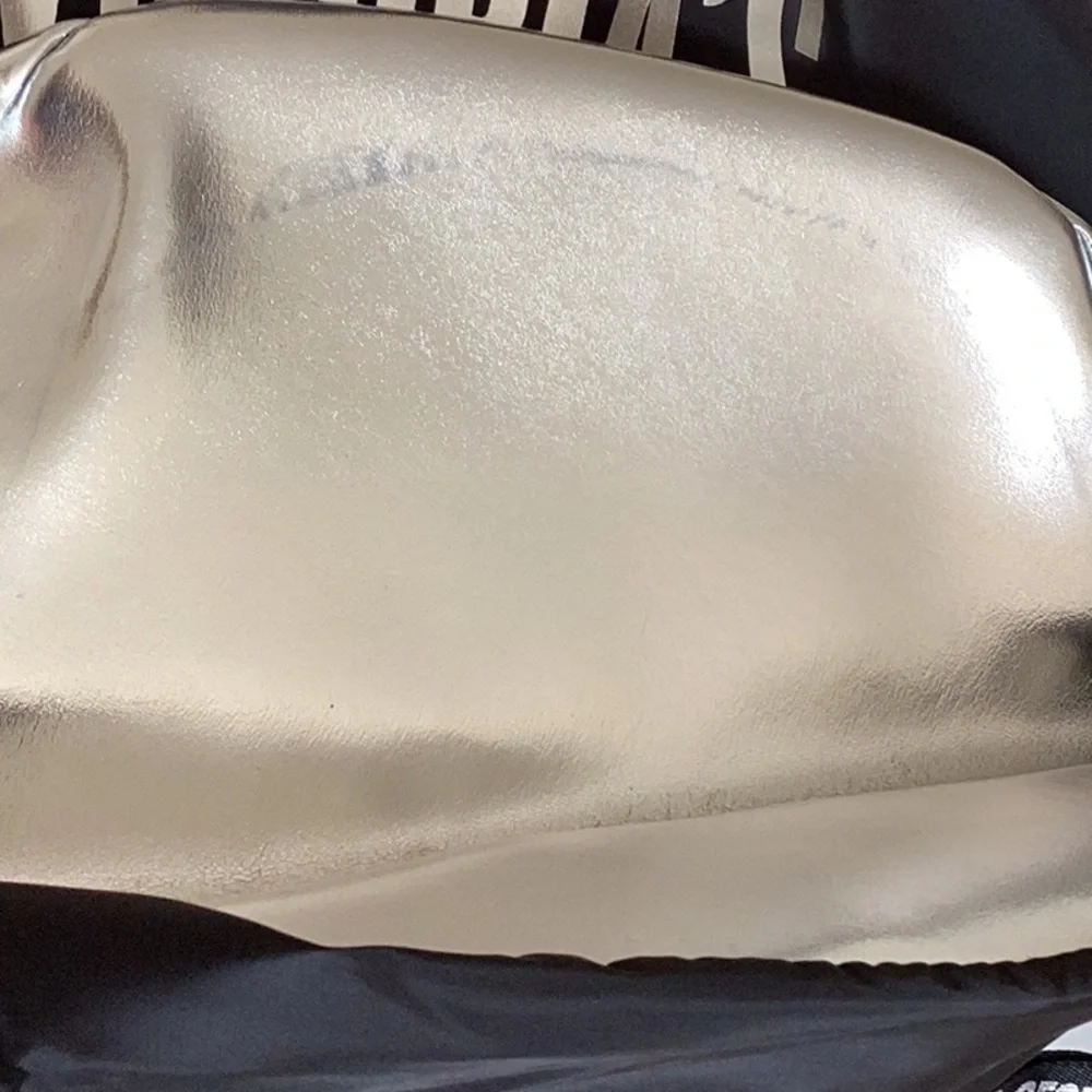 VICTORIA’S Secret black and silver backpack.